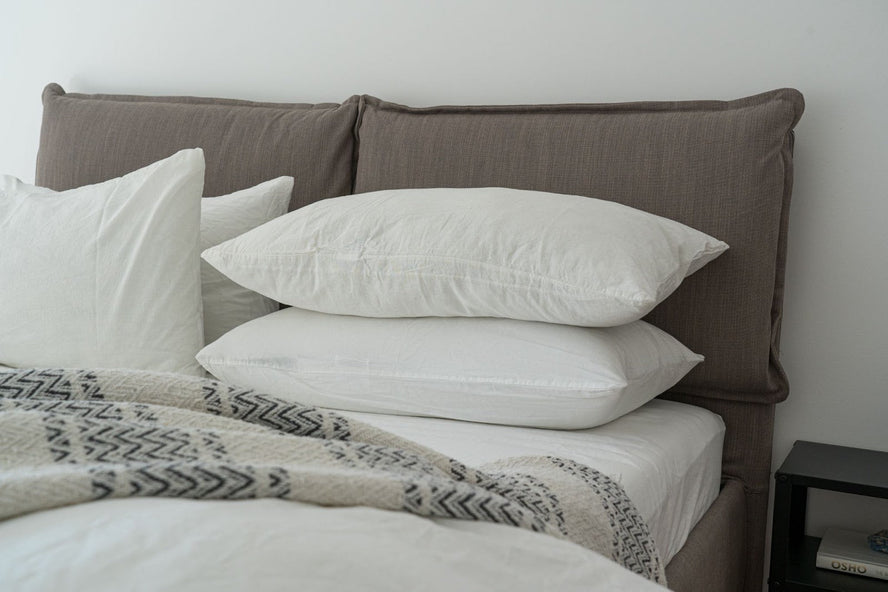 Stack of pillows on a bed 