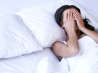 Woman worrying about not getting to sleep