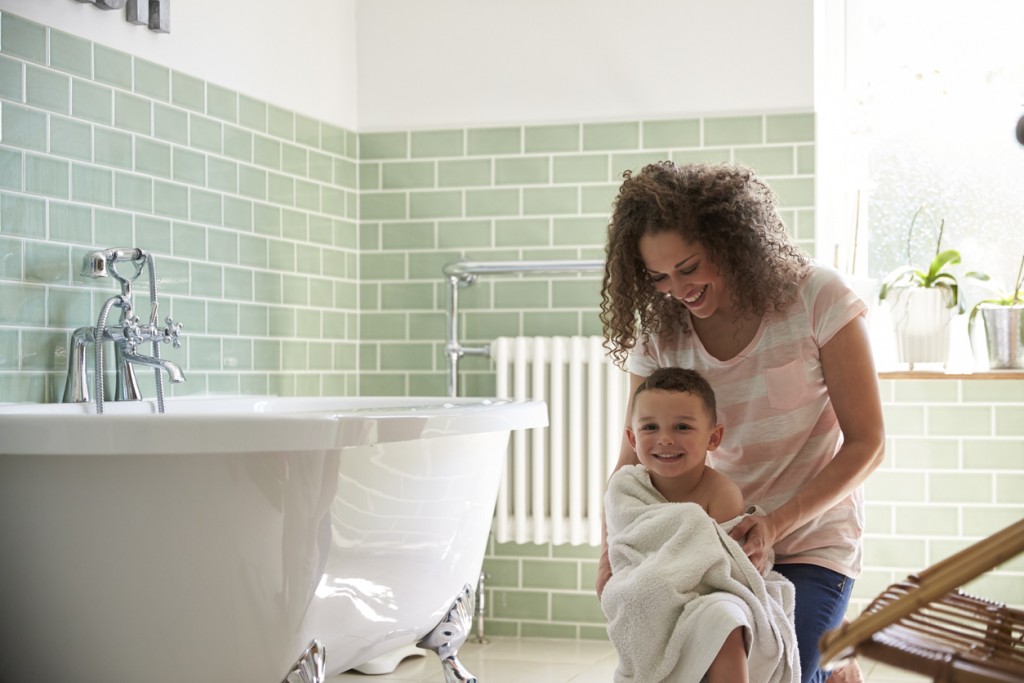 Mother Drying Son With Towel After Bath